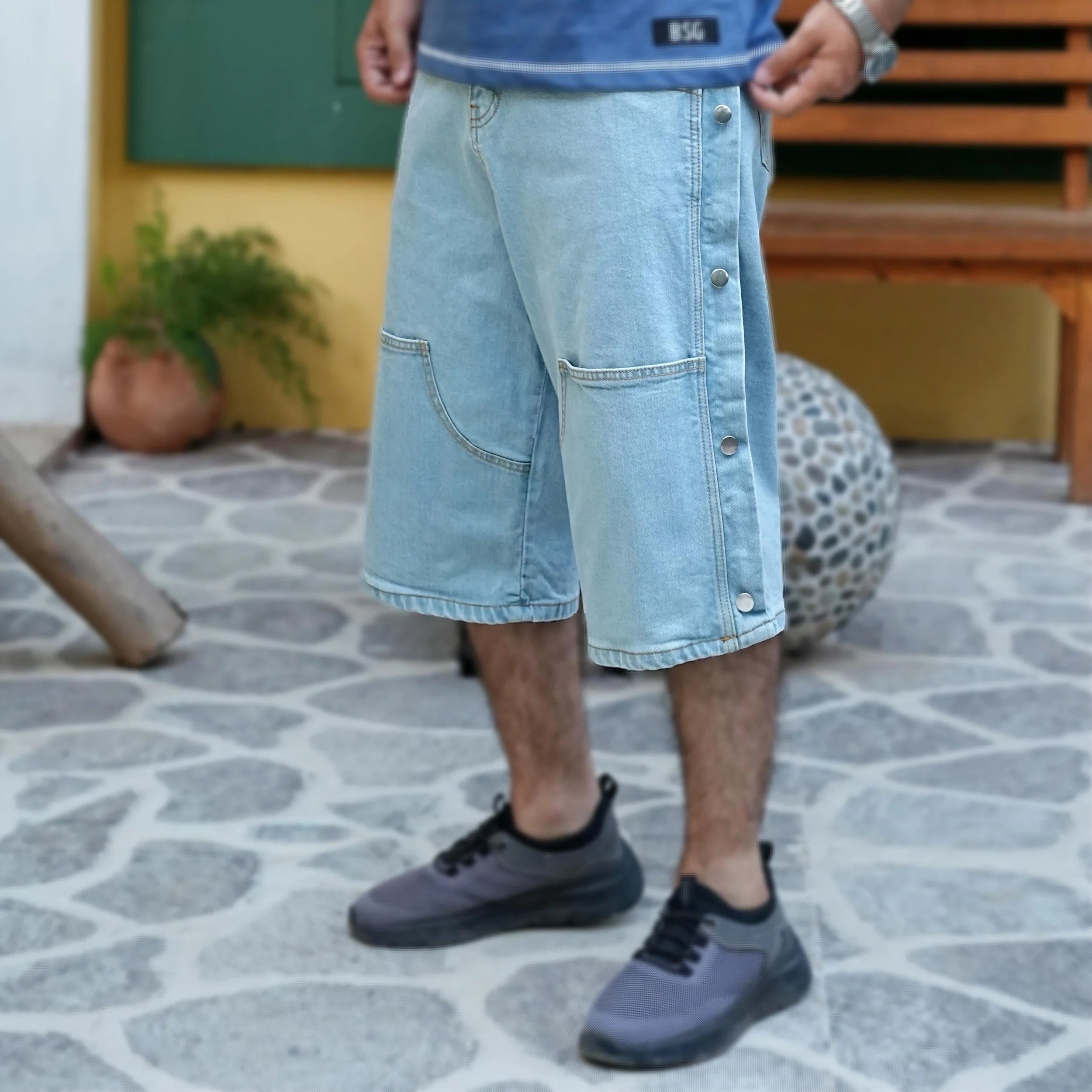 Men Jeans showcased in a modern style with a sleek design and unique patchwork pattern
