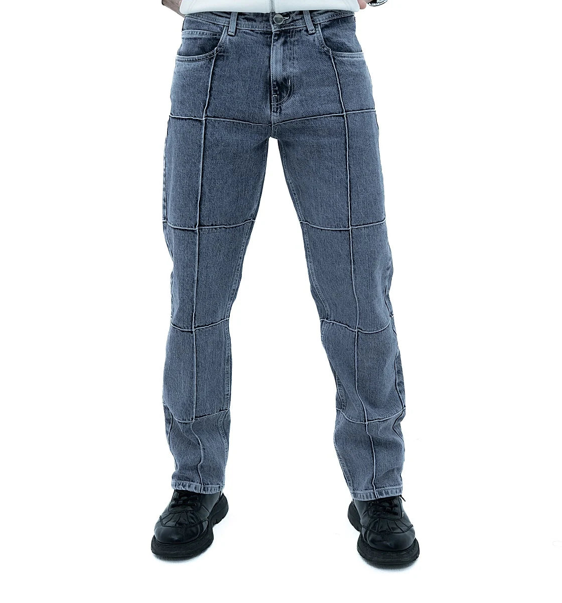 Men Jeans showcased in a modern style with a sleek design and unique patchwork pattern