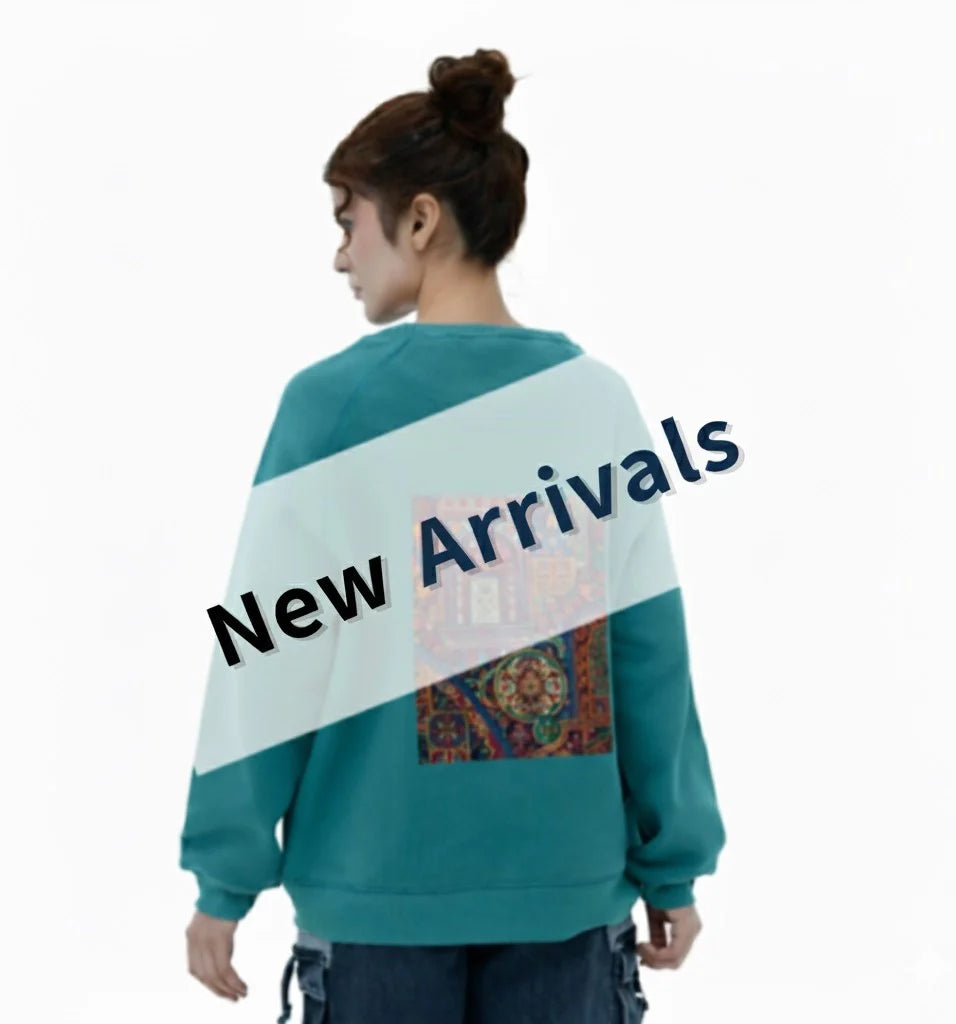 Women New Arrival collection featuring a stylish teal sweatshirt with patterned back design