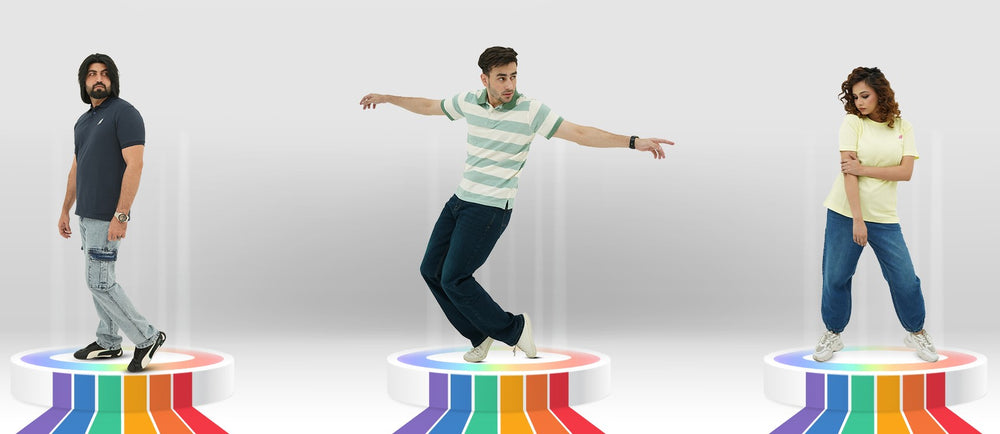 Three people standing on platforms with rainbow patterns, wearing BSG casual clothing.