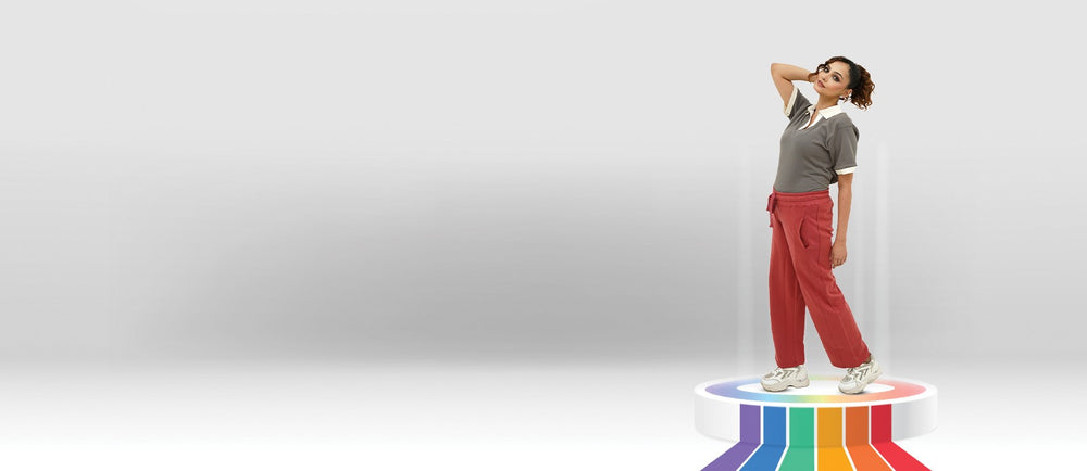 Woman standing on a platform with a rainbow pattern against a white background