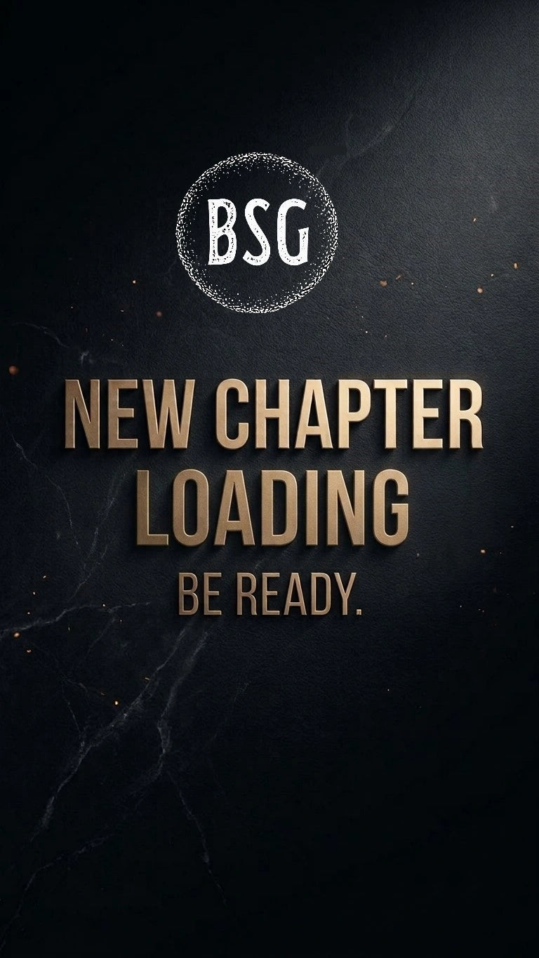 BSG website coming soon graphic displaying "NEW CHAPTER LOADING BE READY" in embossed gold lettering with animated ember accents.