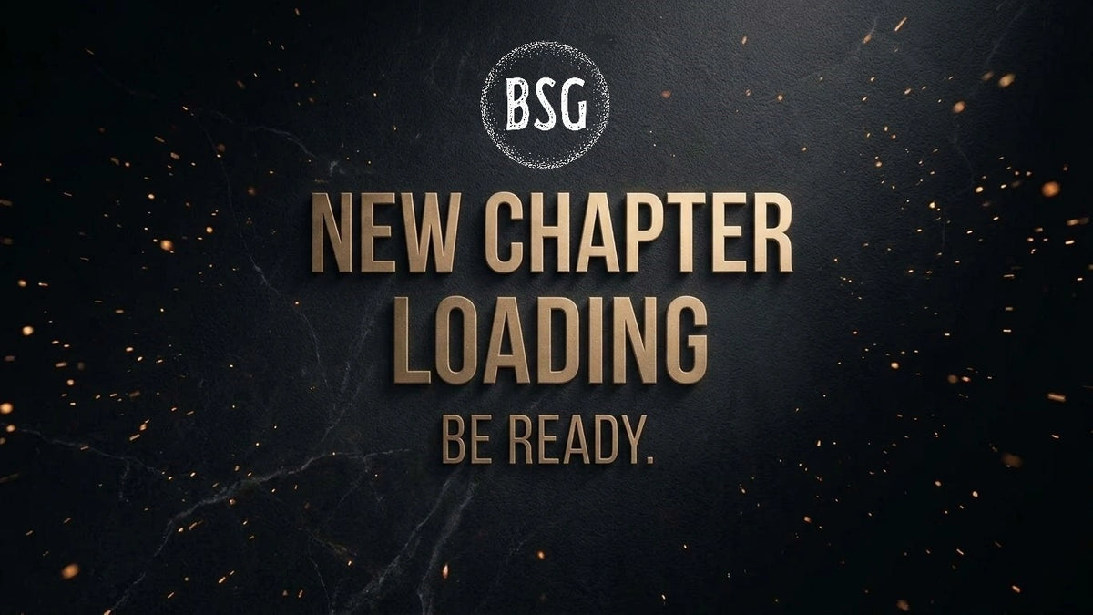 BSG website coming soon graphic displaying "NEW CHAPTER LOADING BE READY" in embossed gold lettering with animated ember accents.