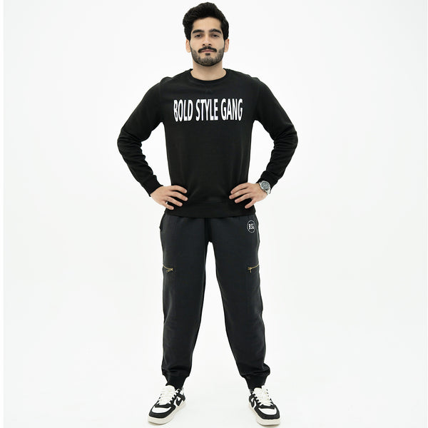 Man wearing a black 'Bolo Style Gang' outfit on a white background