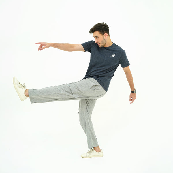 Man in BSG athletic wear posing on a white background