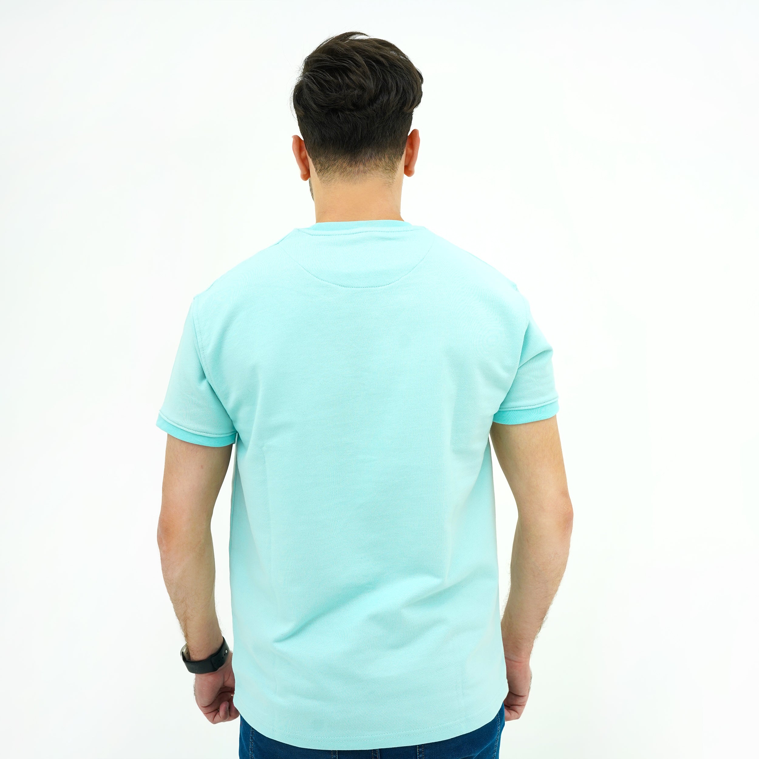 Back view of a man's Aqua Breeze Misty Wave Terry Tee Shirt in a light blue color