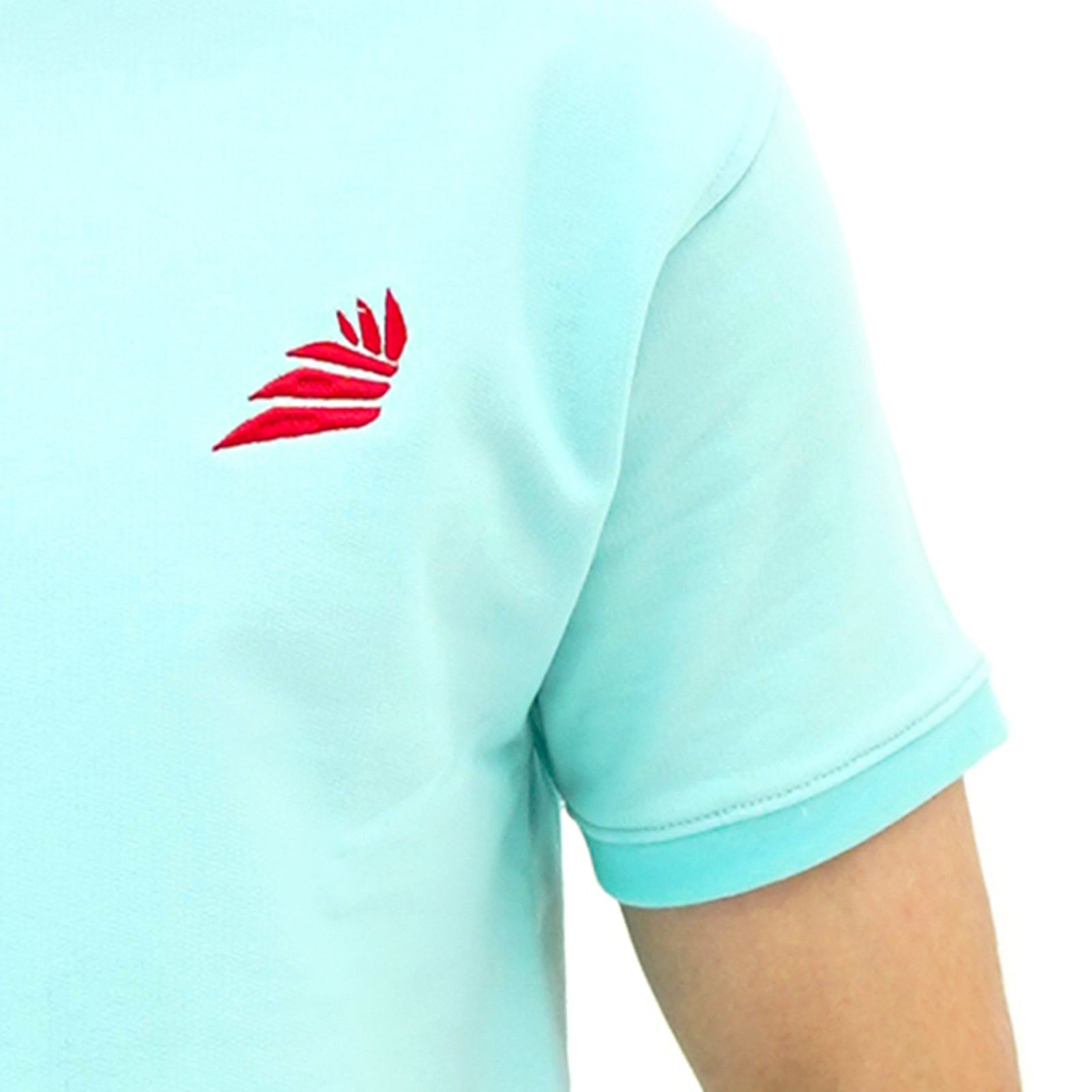 Aqua Breeze Misty Wave Terry Tee Shirt featuring a red emblem on a light blue background