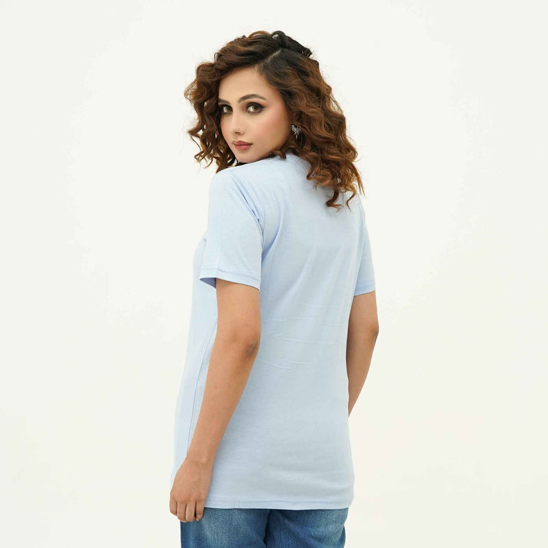 Back view of woman wearing BSG Azure Noir Chic Contrast Tee Shirt in light blue with short sleeves