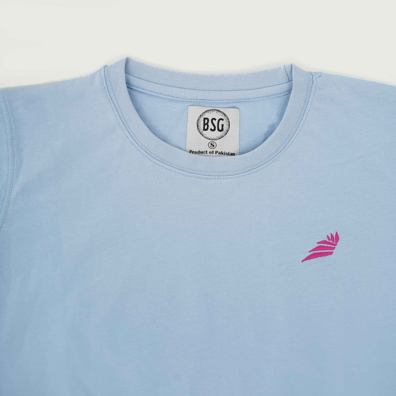 BSG women’s Azure Noir Chic Contrast Tee Shirt in light blue with round neckline and pink logo embroidery