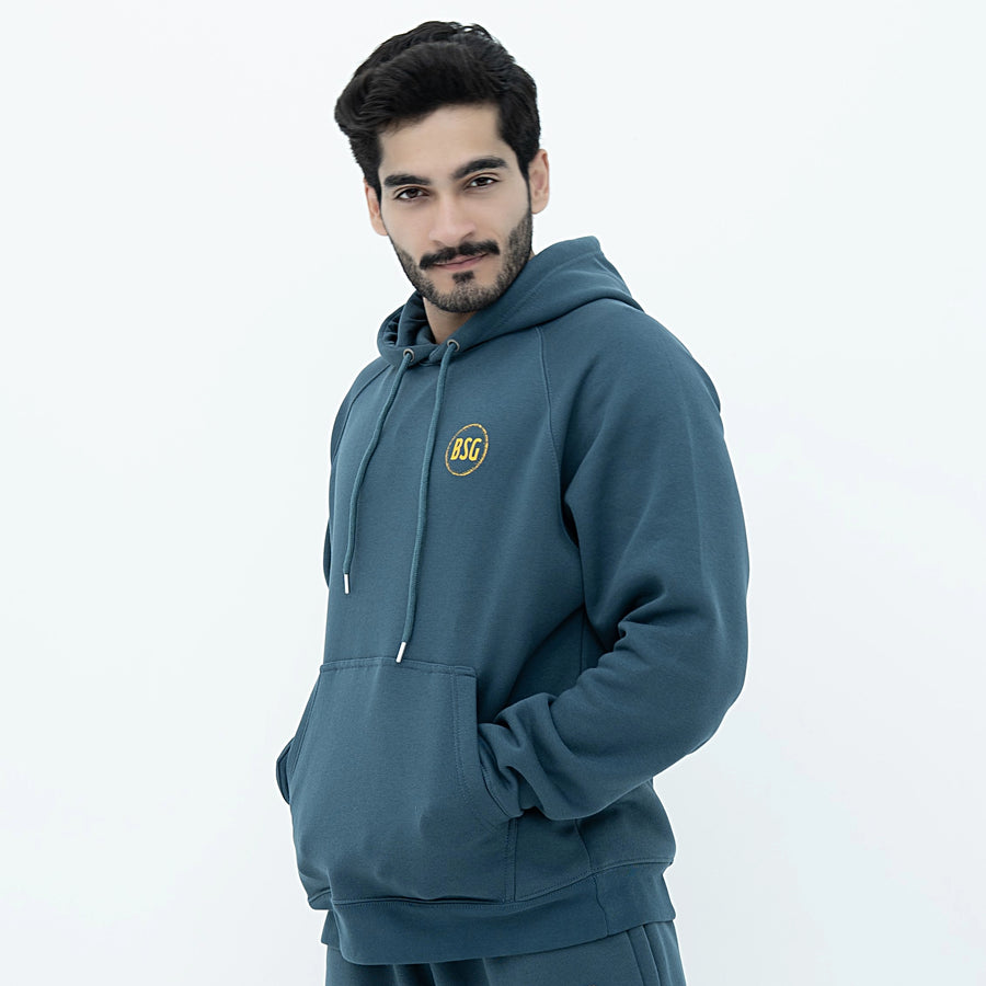 Model wearing Bold Style Generation Signature Deep Teal Hoodie featuring front pocket and drawstring hood