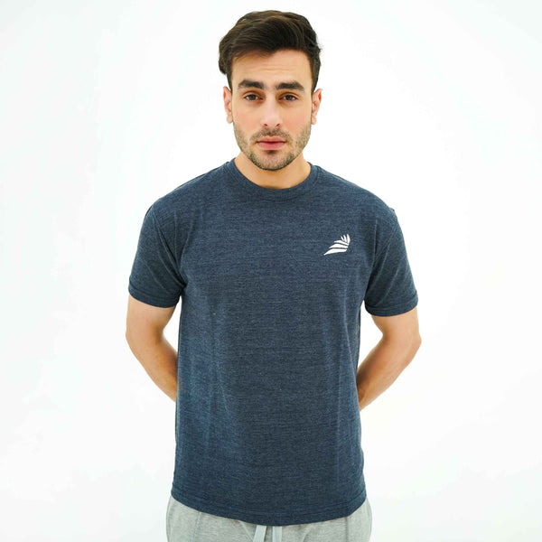 Man wearing BSG Boldly Born Black Tee Shirt in dark navy with small white logo on chest