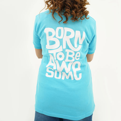 Women's Boldly Born Blue Brilliance Tee Shirt with a fun graphic that reads 'Born to be Awesome' on the back
