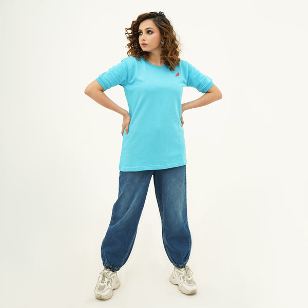 Woman wearing BSG Boldly Born Blue Brilliance Tee Shirt with casual blue jeans and sneakers