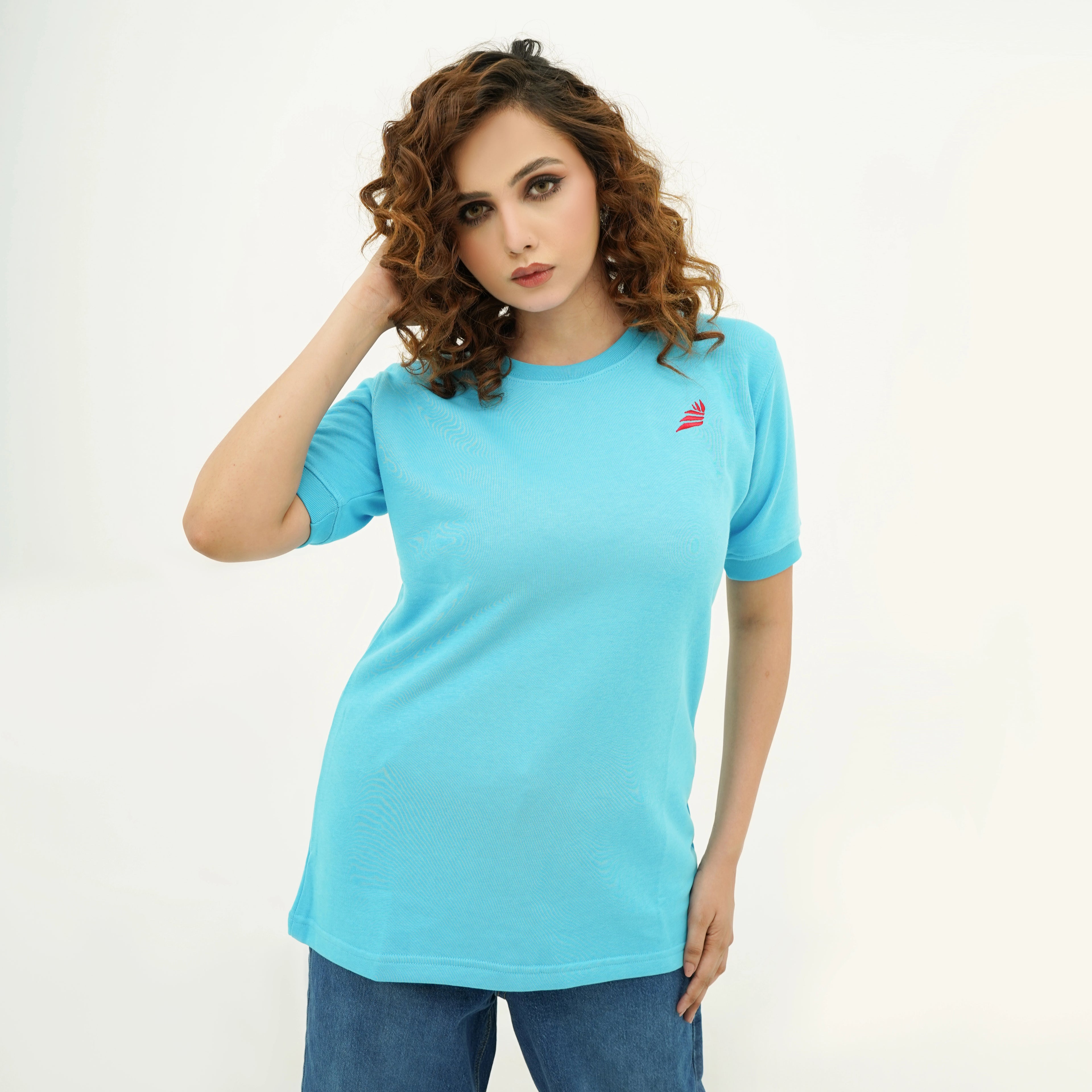 Model wearing the Boldly Born Blue Brilliance Tee Shirt in bright blue, perfect for casual outings.