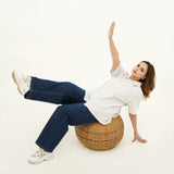 Woman wearing BSG Indigo Blue Wide Leg Jeans paired with white sneakers and a striped top