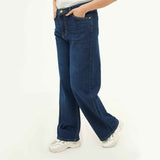 BSG women's indigo blue wide leg jeans styled with white sneakers and a casual top