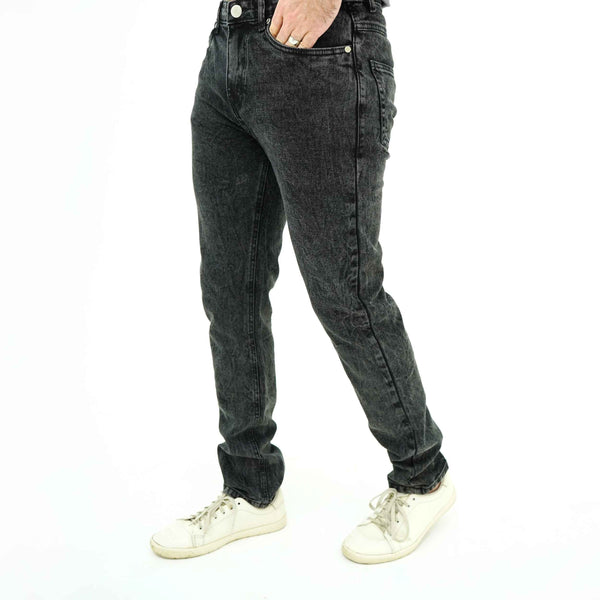 BSG men's Modern Minimalist Black Jeans in slim fit paired with white sneakers