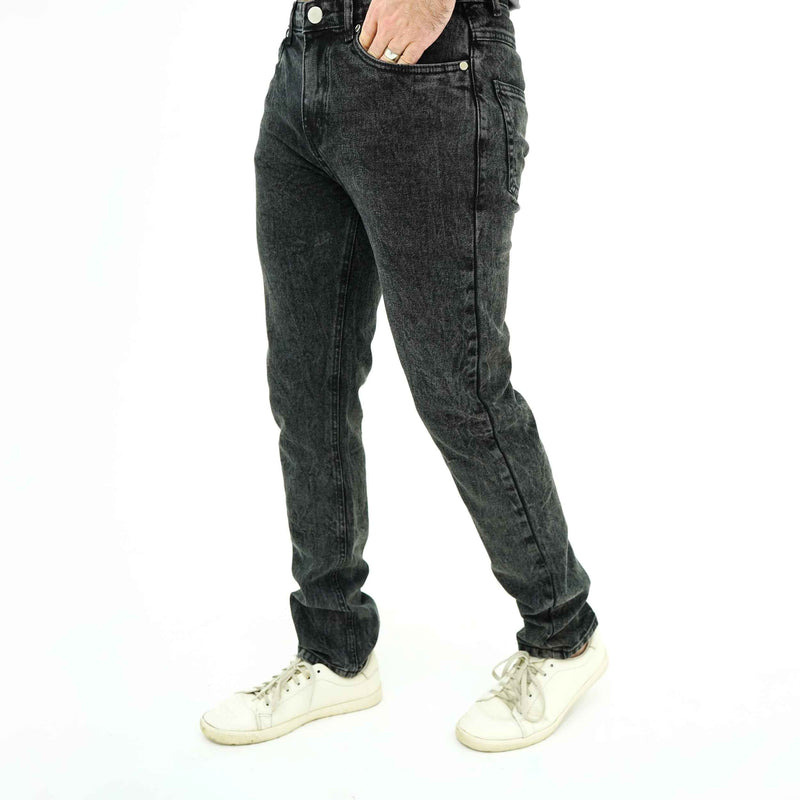 BSG men's Modern Minimalist Black Jeans in slim fit paired with white sneakers