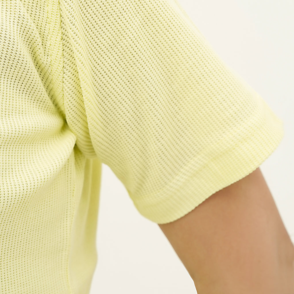 Close-up of the Citrus Weave Breeze Tee Shirt showing breathable fabric and comfortable fit