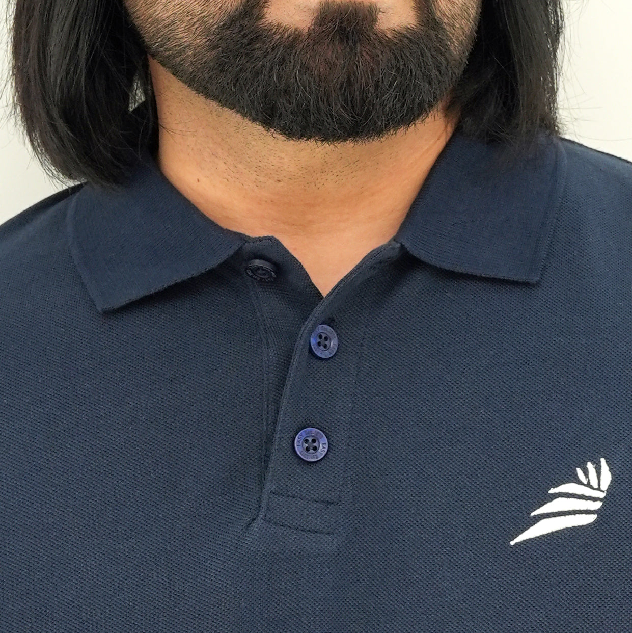 Classic Elegant Navy Blue Polo from BSG featuring a stylish collar and subtle logo detail