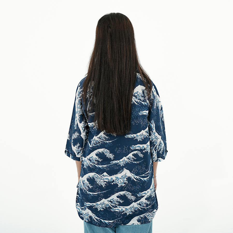 Back view of the Coastal Breeze Button-Up Shirt for women featuring a wave pattern and relaxed fit