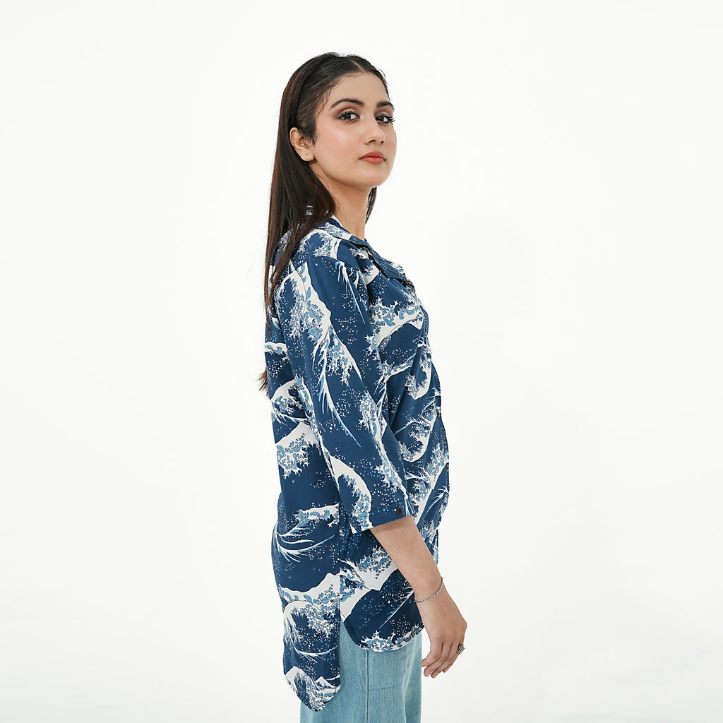 Model wearing BSG Coastal Breeze Button-Up Shirt with wave pattern in navy and white