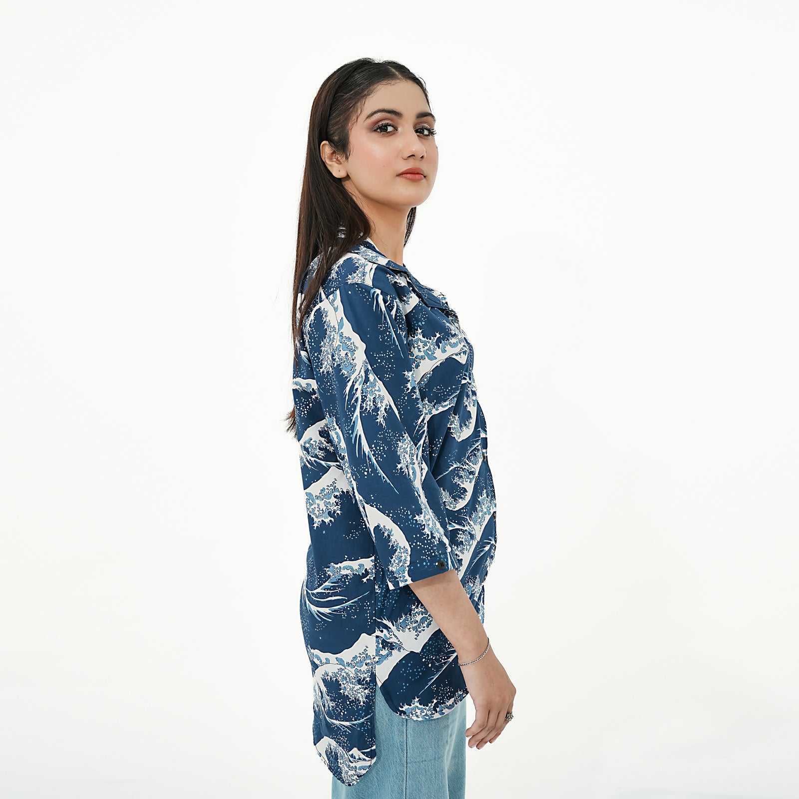 Model wearing BSG Coastal Breeze Button-Up Shirt with wave pattern in navy and white