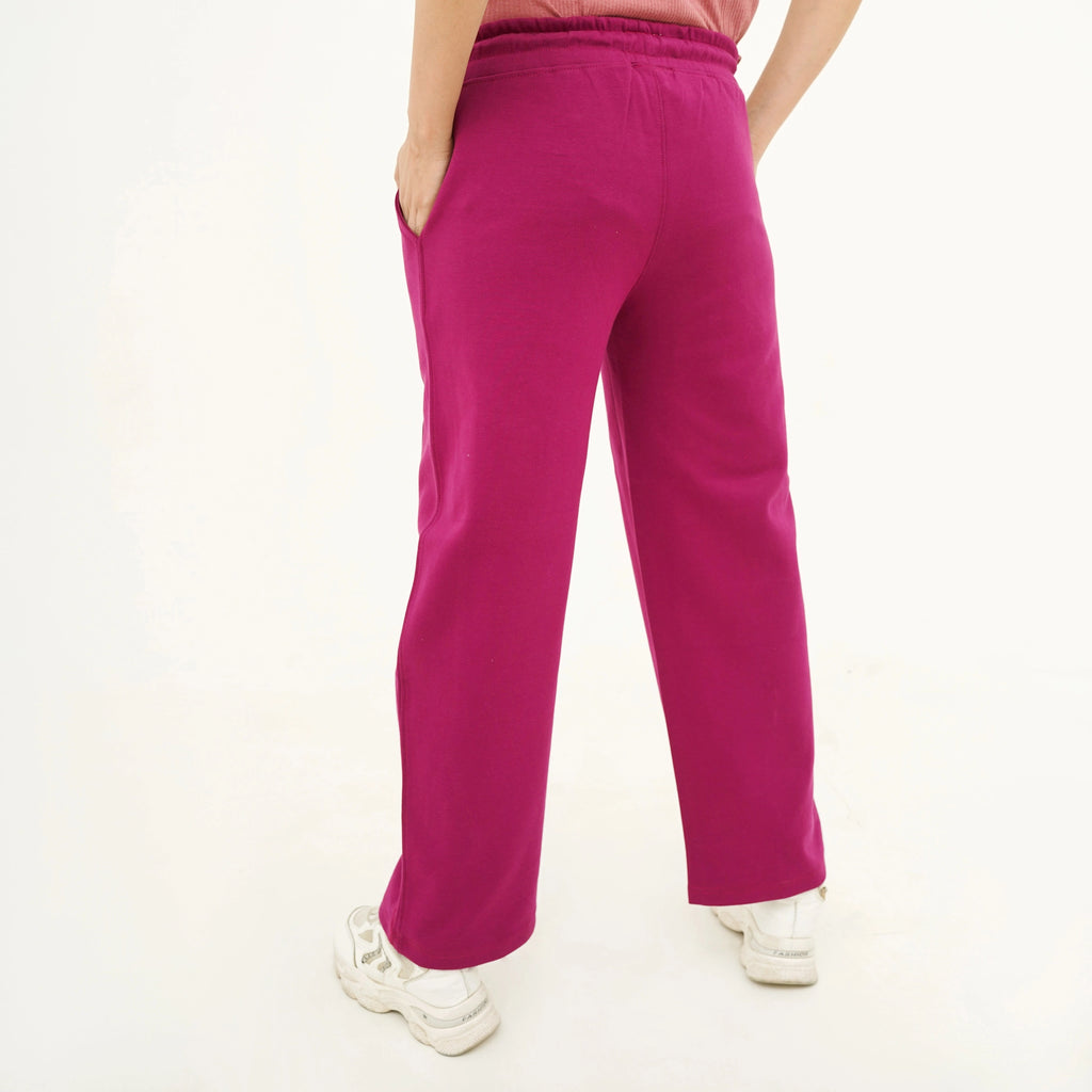 Back view of Cozy Magenta Berry Trouser for women, featuring a relaxed fit and soft material