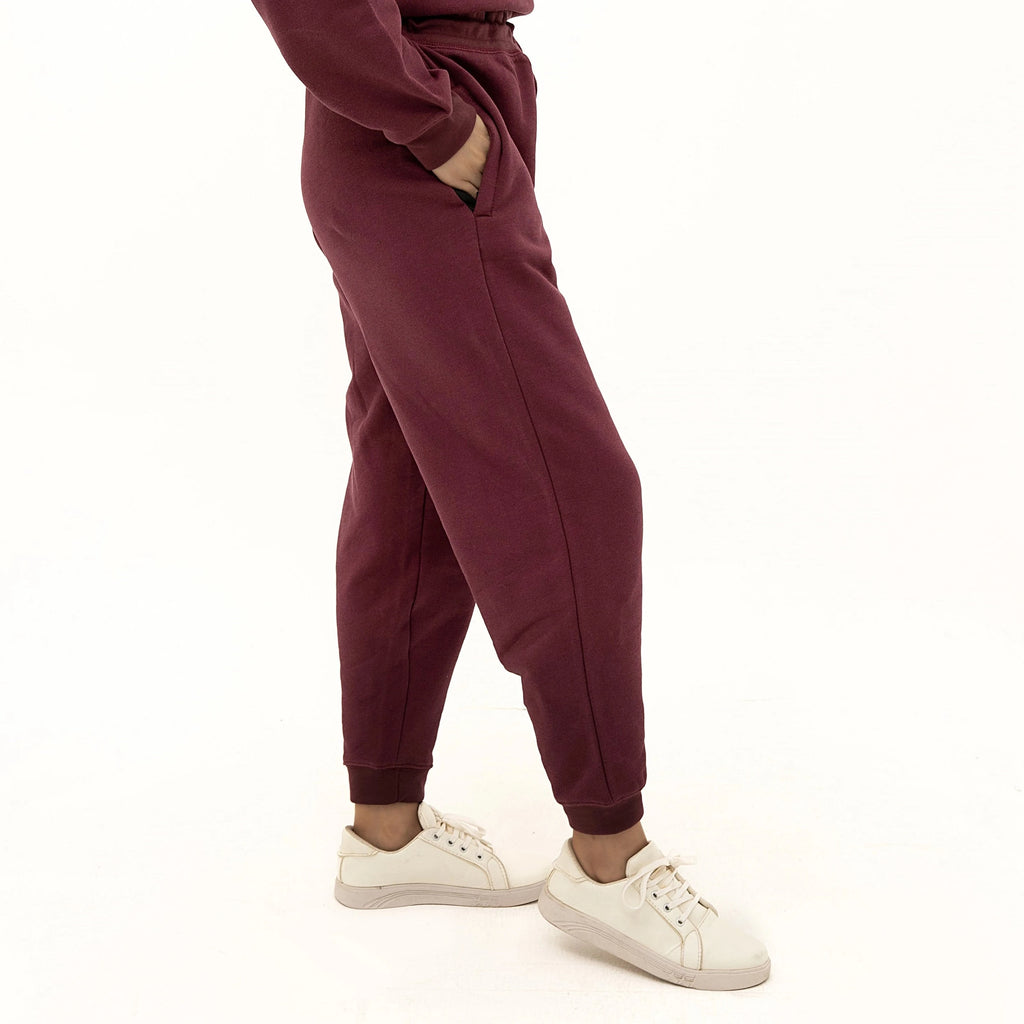 Model wearing Cozy Soft Touch Maroon Sweatpants with side pockets and comfortable fit for casual outings