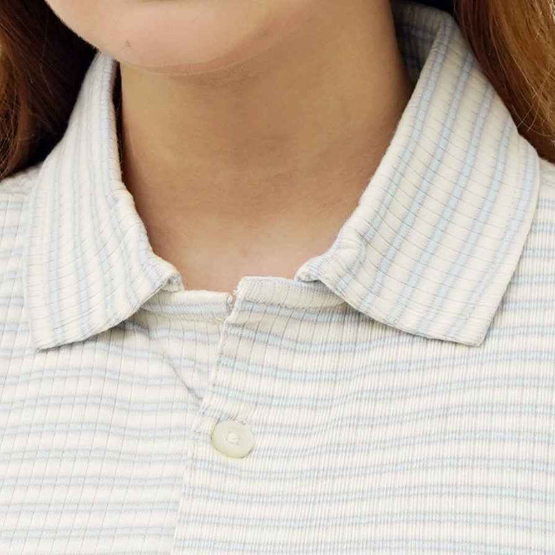 Close-up of BSG women's Striped Cream Button Down Polo with collar and button detail