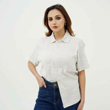 BSG women's striped cream button down polo shirt paired with dark blue jeans