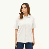 BSG women's Striped Cream Button Down Polo shirt with short sleeves and collar paired with blue jeans
