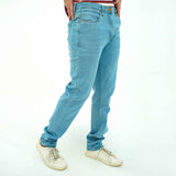 BSG men's denim jeans in light blue featuring Urban Sky Stretchy Slims fit styled with white sneakers